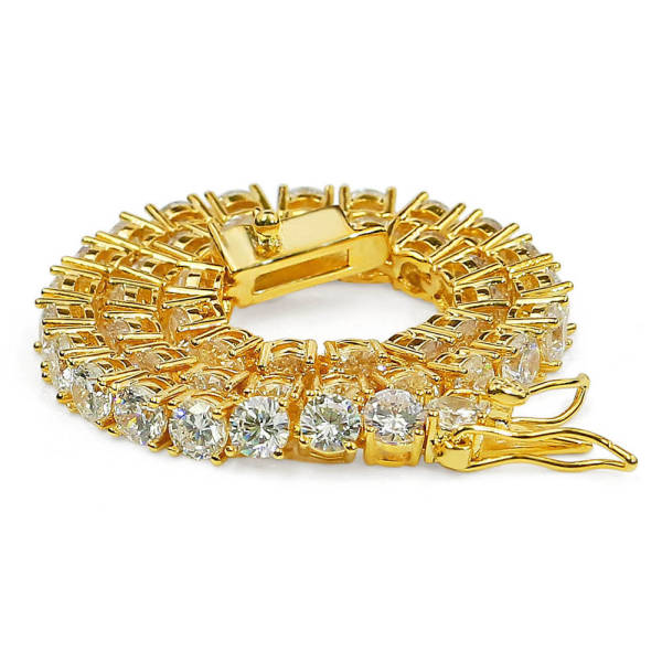 Chunky tennis bracelet with large round cubic zirconia stones, shown stacked in gold and silver tones on a wrist