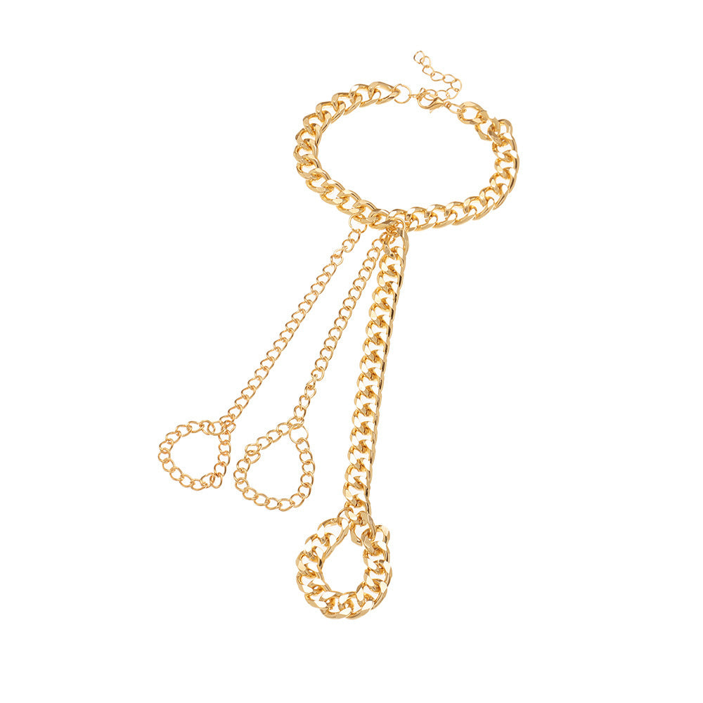 Gold chunky cuban chain bracelet with three chains running down the back of the hand to three chain finger loops