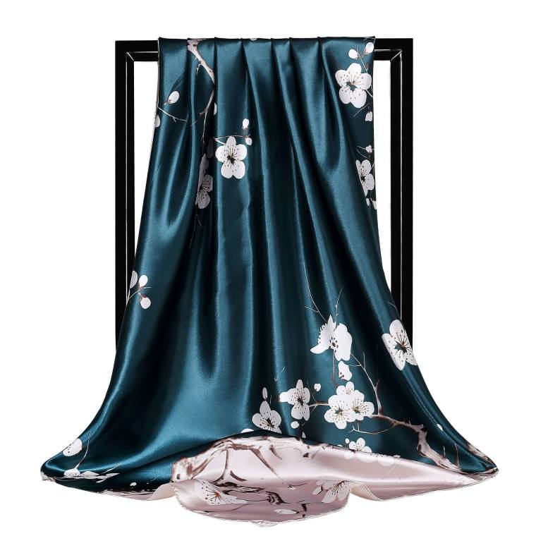 Large satin square scarf draped to show its print; available in six prints from soft florals to paisley