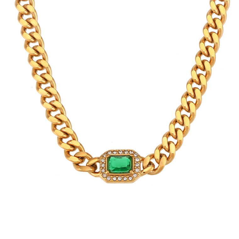 Gold curb chain necklace and bracelet, each with one emerald-cut colored stone in a pavé halo at the center