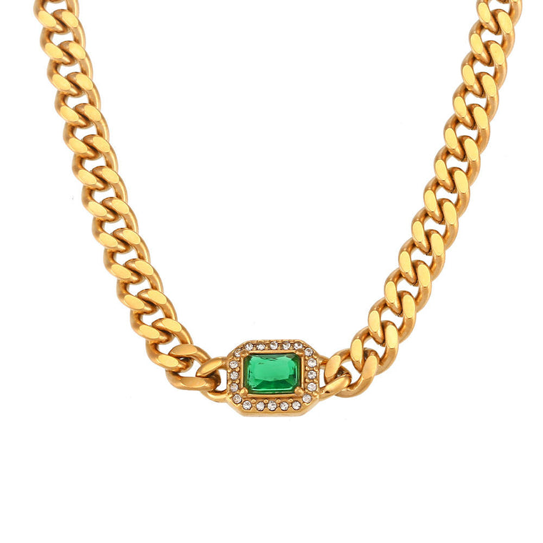 Gold-tone curb chain necklace and bracelet, each with one emerald-cut colored stone in a pavé halo at the center
