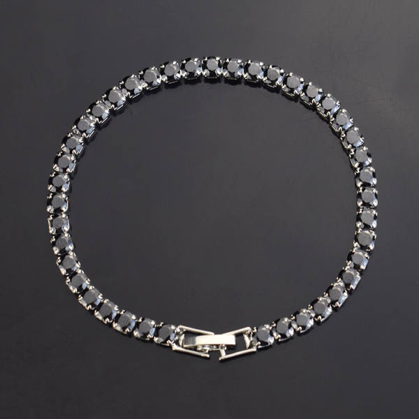 Tennis bracelets with round colored stones — white, pink, blue, green, black and aqua — with fold-over clasps