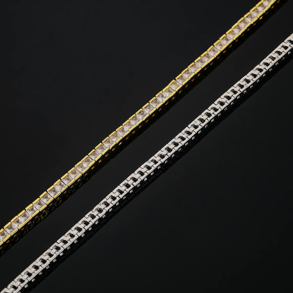 Tennis bracelet of square-cut cubic zirconia set edge to edge, shown in gold-tone and silver-tone