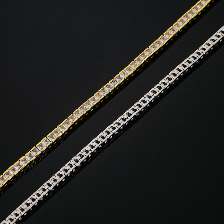 Tennis bracelet of square-cut cubic zirconia set edge to edge, shown in gold and silver