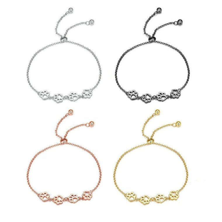Slider-clasp chain bracelet with four open paw-print charms