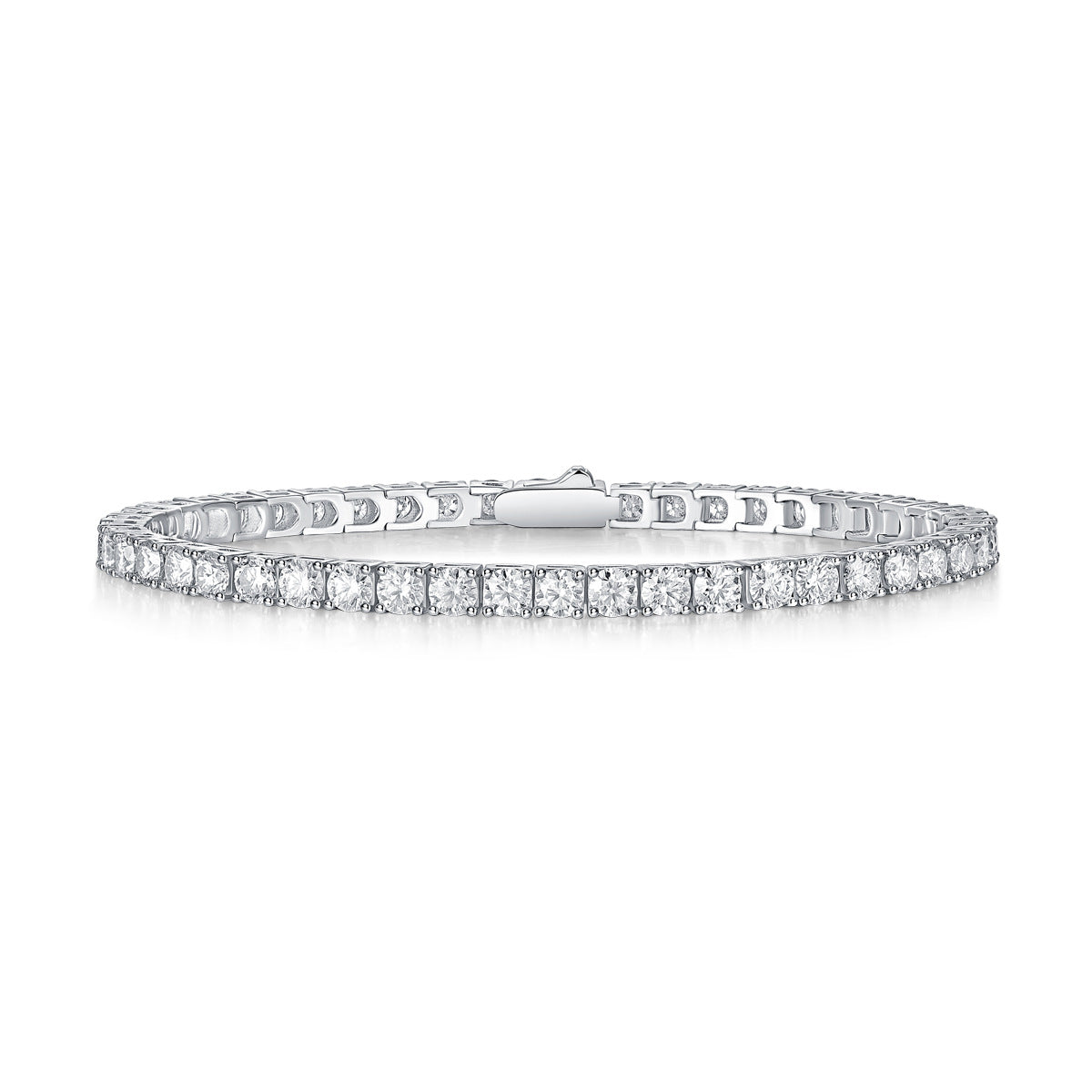 Single-row lab-grown moissanite tennis bracelet in four-prong settings, shown on white and worn on the wrist
