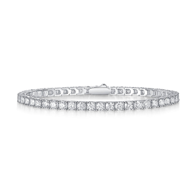 Single-row lab-grown moissanite tennis bracelet in four-prong settings, shown on white and worn on the wrist